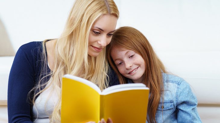 Mom reading with daughter