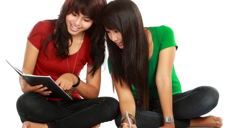 two high school students doing peer-assisted learning