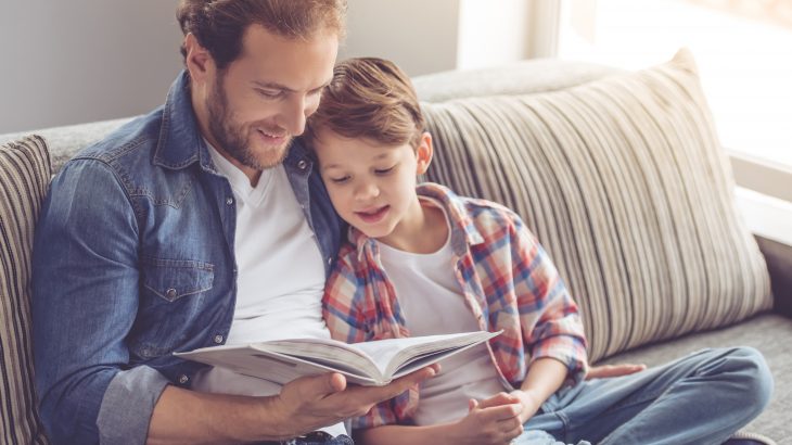 Father reading to son