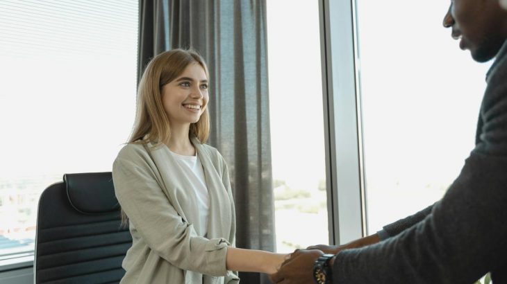 School to Career Transition: Job candidate shaking hands with interviewer